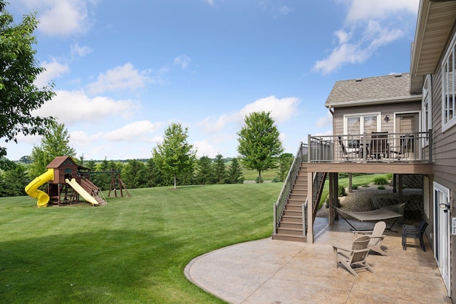 9015 Schutte Ct, Corcoran, MN 55340 - view of grassy yard featuring stairway, a patio, a playground, and a deck