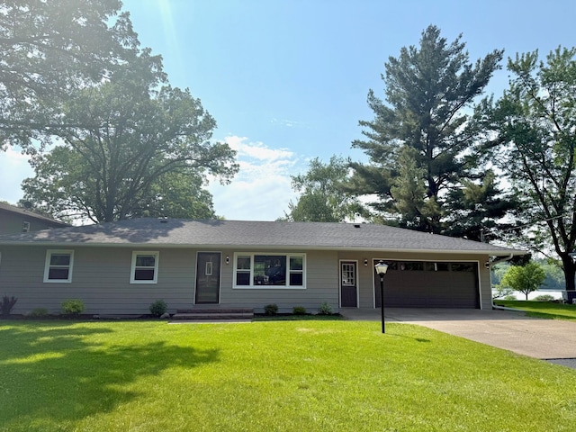 17535 Riverwood Dr, Little Falls, MN 56345 - ranch-style house with an attached garage, driveway, and a front lawn