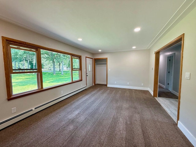 17535 Riverwood Dr, Little Falls, MN 56345 - unfurnished bedroom featuring a baseboard radiator, recessed lighting, dark colored carpet, and a closet