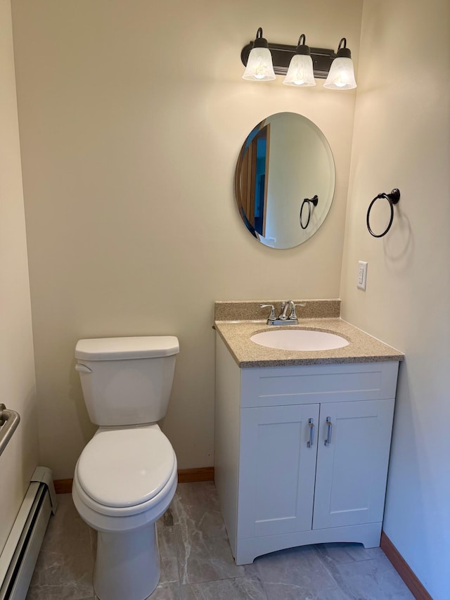 17535 Riverwood Dr, Little Falls, MN 56345 - half bath featuring baseboard heating, vanity, and marble look tiles