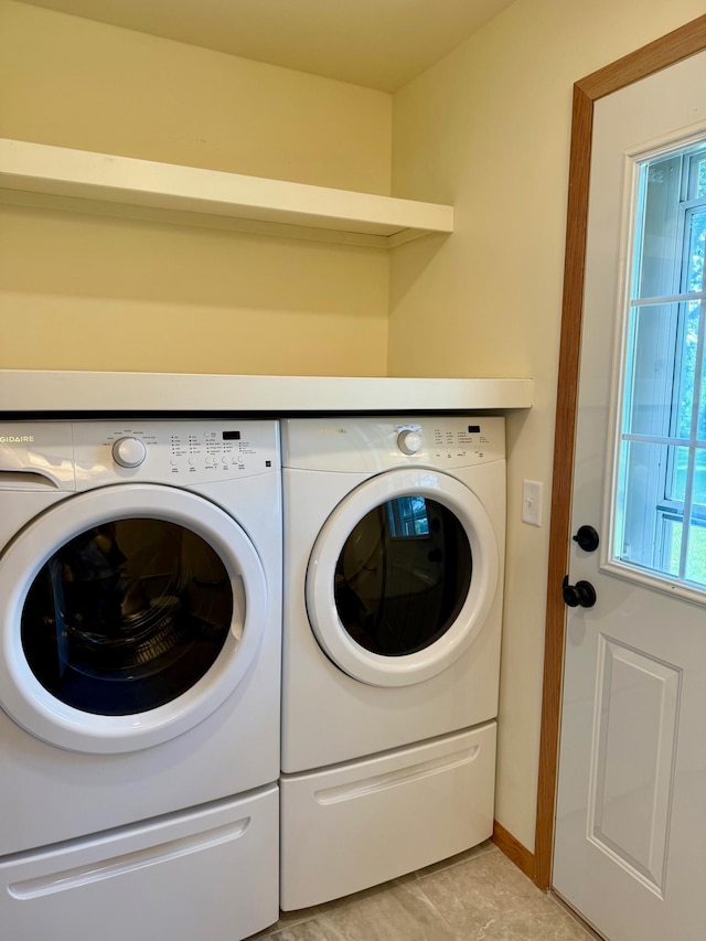 17535 Riverwood Dr, Little Falls, MN 56345 - laundry room with washing machine and dryer and baseboards