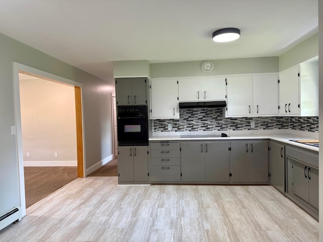 17535 Riverwood Dr, Little Falls, MN 56345 - kitchen featuring black appliances, gray cabinets, baseboard heating, and tasteful backsplash