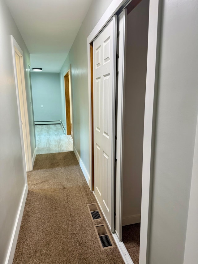 17535 Riverwood Dr, Little Falls, MN 56345 - hallway featuring carpet floors and a baseboard radiator
