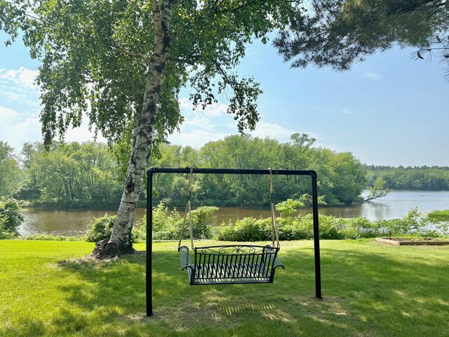 17535 Riverwood Dr, Little Falls, MN 56345 - view of property's community with a water view, a lawn, and a wooded view