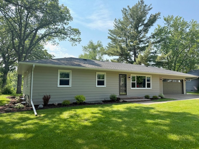 17535 Riverwood Dr, Little Falls, MN 56345 - ranch-style house featuring an attached garage, a front lawn, and driveway
