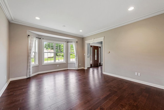 1830 Whitetail Run Pl NE, Owatonna, MN 55060 - spare room with ornamental molding, dark wood-type flooring, and recessed lighting