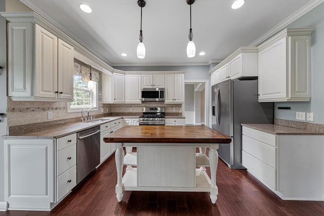 1830 Whitetail Run Pl NE, Owatonna, MN 55060 - kitchen featuring stainless steel appliances, wooden counters, backsplash, dark wood-style flooring, and white cabinetry