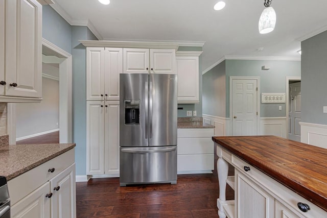 1830 Whitetail Run Pl NE, Owatonna, MN 55060 - kitchen with stainless steel fridge, butcher block countertops, dark wood-type flooring, white cabinetry, and ornamental molding