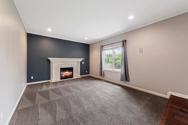1830 Whitetail Run Pl NE, Owatonna, MN 55060 - unfurnished living room with crown molding, carpet floors, a fireplace, and recessed lighting