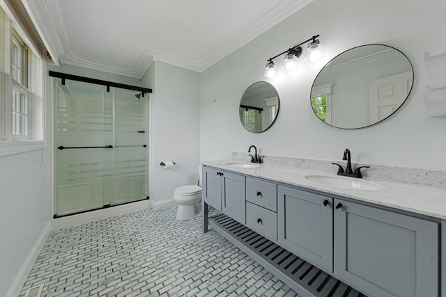 1830 Whitetail Run Pl NE, Owatonna, MN 55060 - bathroom featuring ornamental molding, double vanity, a stall shower, and plenty of natural light