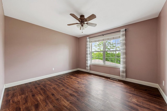 1830 Whitetail Run Pl NE, Owatonna, MN 55060 - empty room featuring dark wood-type flooring and ceiling fan
