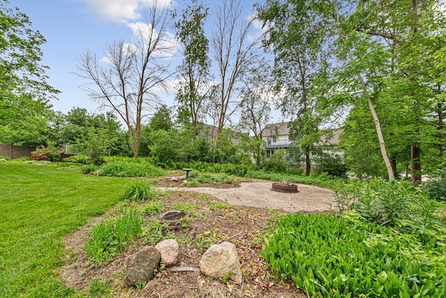1830 Whitetail Run Pl NE, Owatonna, MN 55060 - view of green lawn featuring a fire pit