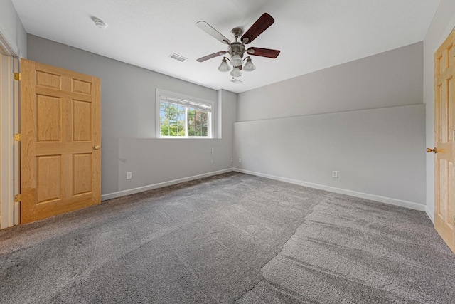 1830 Whitetail Run Pl NE, Owatonna, MN 55060 - carpeted empty room featuring ceiling fan and a smoke detector