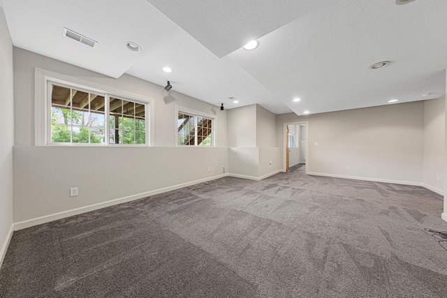 1830 Whitetail Run Pl NE, Owatonna, MN 55060 - empty room featuring carpet floors, recessed lighting, and a textured ceiling