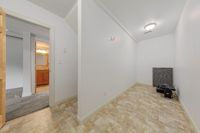 1830 Whitetail Run Pl NE, Owatonna, MN 55060 - empty room featuring stone finish flooring and baseboards