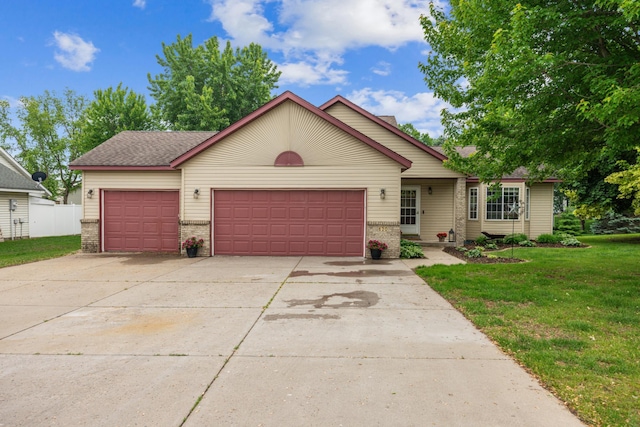 620 Acacia Dr S, Annandale, MN 55302 - view of front facade featuring a front lawn, an attached garage, brick siding, and driveway