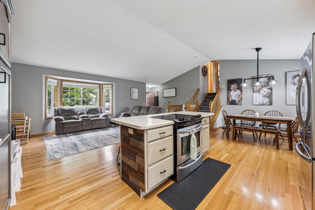 620 Acacia Dr S, Annandale, MN 55302 - kitchen with stainless steel appliances, light wood-type flooring, light countertops, open floor plan, and lofted ceiling