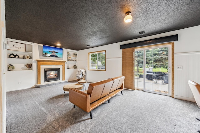 620 Acacia Dr S, Annandale, MN 55302 - carpeted living area featuring a textured ceiling and a glass covered fireplace