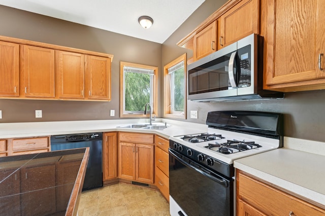 936 Waterford Way, Jordan, MN 55352 - kitchen featuring white range with gas cooktop, black dishwasher, stainless steel microwave, and light countertops
