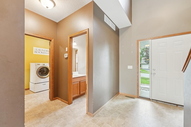 936 Waterford Way, Jordan, MN 55352 - foyer entrance with washer / clothes dryer and light flooring