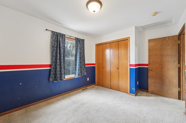 936 Waterford Way, Jordan, MN 55352 - unfurnished bedroom featuring carpet flooring, a closet, and attic access