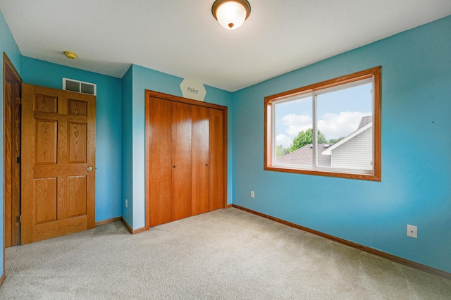 936 Waterford Way, Jordan, MN 55352 - unfurnished bedroom with a closet and carpet flooring
