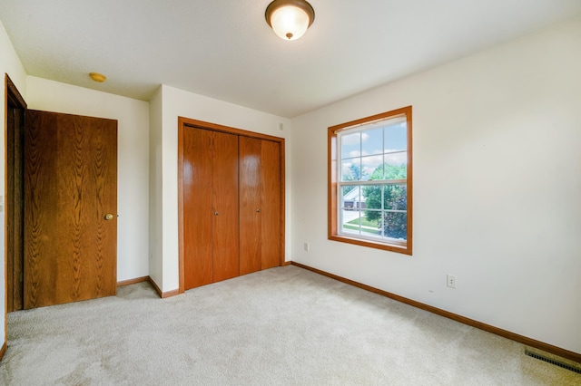 936 Waterford Way, Jordan, MN 55352 - unfurnished bedroom featuring a closet and carpet