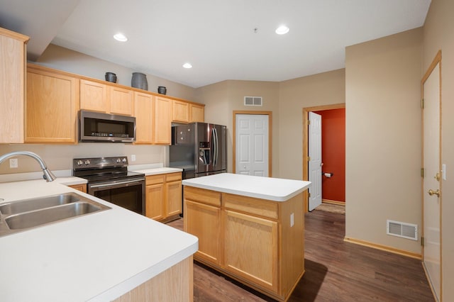 1471 111th Dr NE Unit B, Blaine, MN 55449 - kitchen featuring stainless steel appliances, light brown cabinetry, a center island, dark wood-style flooring, and light countertops