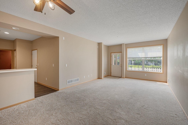 1471 111th Dr NE Unit B, Blaine, MN 55449 - carpeted empty room featuring a ceiling fan and a textured ceiling