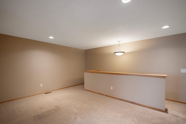 1471 111th Dr NE Unit B, Blaine, MN 55449 - empty room featuring light colored carpet, recessed lighting, and a textured ceiling