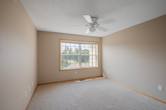 1471 111th Dr NE Unit B, Blaine, MN 55449 - unfurnished room featuring carpet flooring, ceiling fan, and a textured ceiling