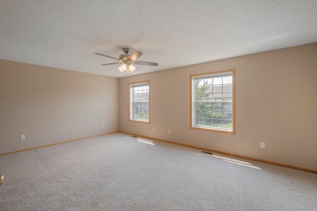 1471 111th Dr NE Unit B, Blaine, MN 55449 - carpeted spare room with a ceiling fan and a textured ceiling