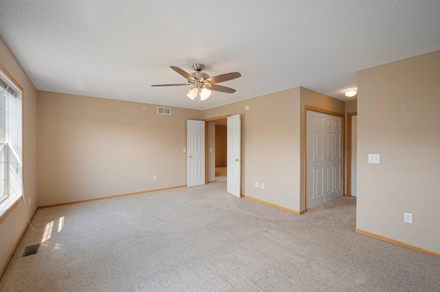1471 111th Dr NE Unit B, Blaine, MN 55449 - unfurnished room with ceiling fan, light carpet, and a textured ceiling