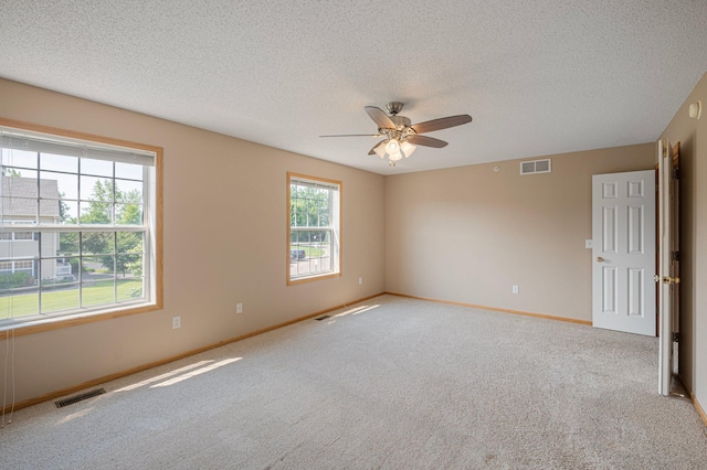 1471 111th Dr NE Unit B, Blaine, MN 55449 - carpeted empty room featuring a textured ceiling and a ceiling fan