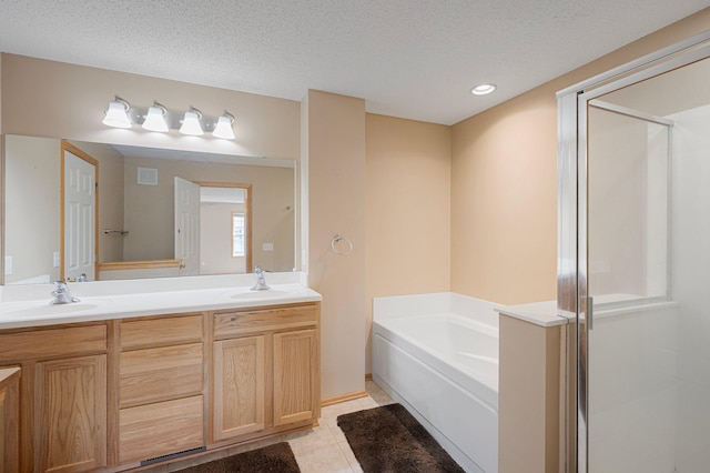 1471 111th Dr NE Unit B, Blaine, MN 55449 - full bath with a garden tub, double vanity, a stall shower, a textured ceiling, and tile patterned floors