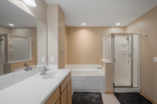 1471 111th Dr NE Unit B, Blaine, MN 55449 - bathroom featuring a shower stall, a bath, vanity, tile patterned flooring, and recessed lighting