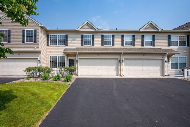 1471 111th Dr NE Unit B, Blaine, MN 55449 - view of property with asphalt driveway, a front yard, and a garage