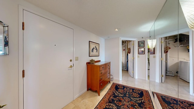 600 4th St SW Unit 401, Rochester, MN 55902 - entrance foyer with a baseboard radiator and baseboards