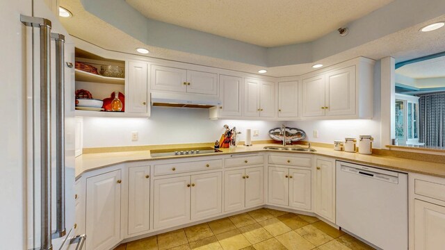600 4th St SW Unit 401, Rochester, MN 55902 - kitchen with dishwasher, high quality fridge, under cabinet range hood, black electric stovetop, and white cabinets