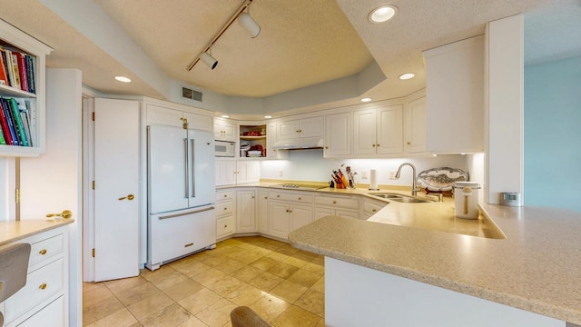 600 4th St SW Unit 401, Rochester, MN 55902 - kitchen with white appliances, under cabinet range hood, open shelves, recessed lighting, and light countertops
