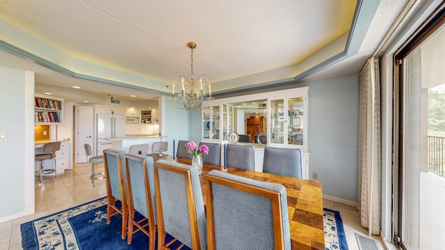 600 4th St SW Unit 401, Rochester, MN 55902 - dining room featuring a chandelier, light tile patterned flooring, recessed lighting, and a tray ceiling