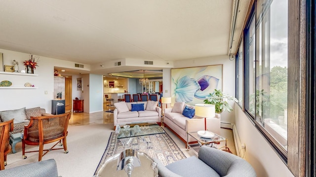 600 4th St SW Unit 401, Rochester, MN 55902 - living area with a chandelier, a baseboard radiator, and carpet floors