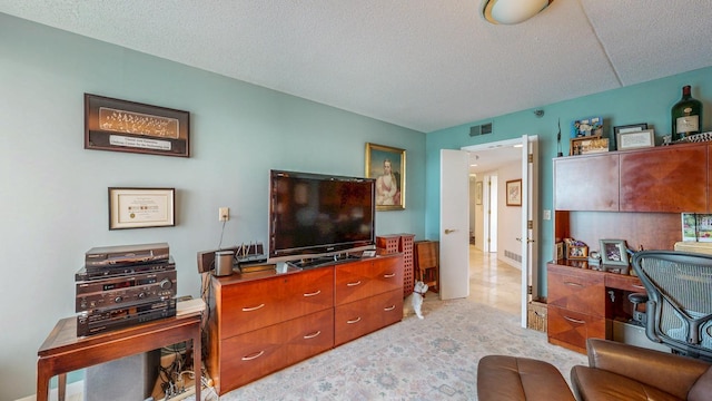 600 4th St SW Unit 401, Rochester, MN 55902 - living room featuring a desk and a textured ceiling