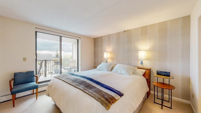 600 4th St SW Unit 401, Rochester, MN 55902 - bedroom with access to outside, light colored carpet, wallpapered walls, and a baseboard heating unit