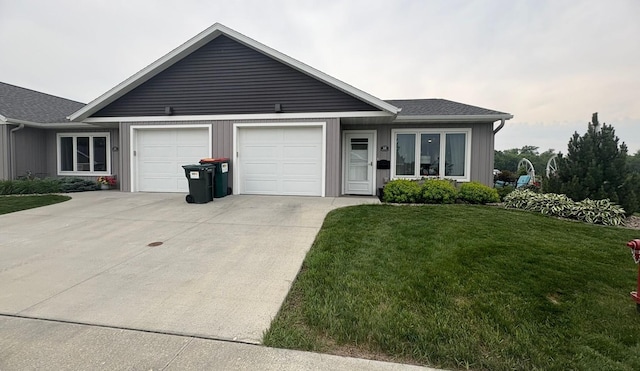 418 Alfred Ct SW, Eyota, MN 55934 - ranch-style home with driveway, a garage, and a front yard
