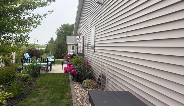 418 Alfred Ct SW, Eyota, MN 55934 - view of property exterior with a patio