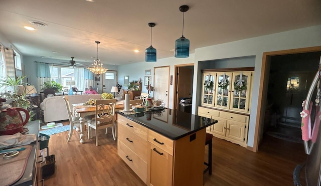 418 Alfred Ct SW, Eyota, MN 55934 - kitchen featuring dark wood finished floors, dark countertops, open floor plan, a ceiling fan, and pendant lighting