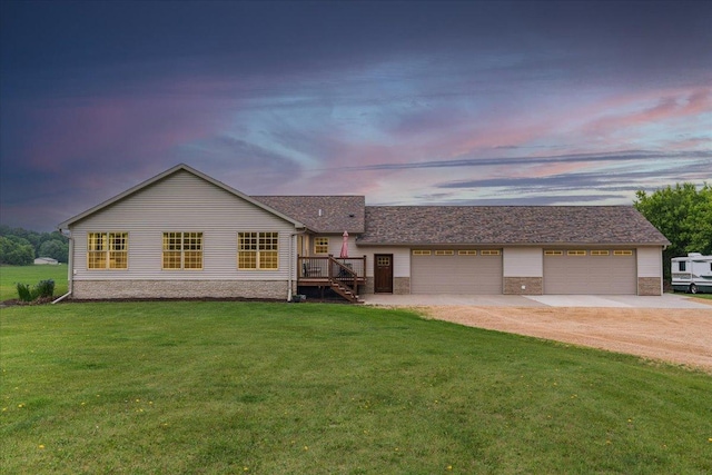 E633 950th Ave, Stanton Twp, WI 54734 - ranch-style home with driveway, a yard, and an attached garage