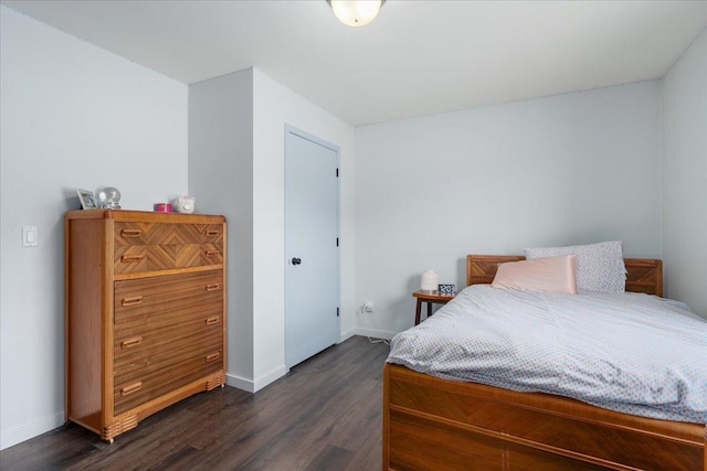 E633 950th Ave, Stanton Twp, WI 54734 - bedroom with dark wood-style floors
