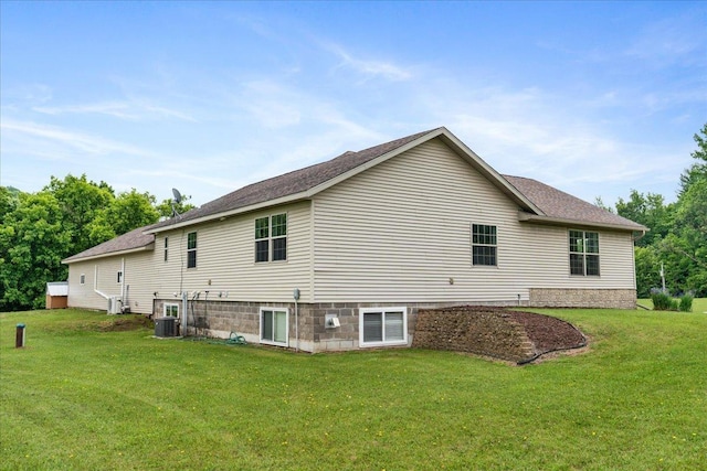 E633 950th Ave, Stanton Twp, WI 54734 - back of house with a lawn and roof with shingles